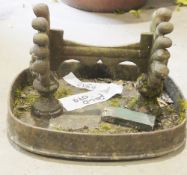 Cast iron boot scraper mounted in a trough