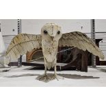 A metal sculpture of an owl Condition Report Height 33.5cm, wing span 65cm, width 29cm