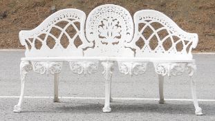 White painted cast metal garden bench with intricate interlocking floral design, 140cm wide