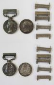 Two Victorian India General Service Medals with five loose clasps, both medals re-named.