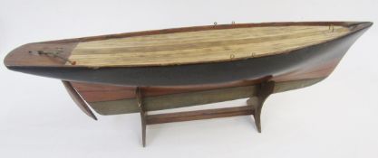Vintage wooden pond yacht with weighted base and rudder, 56cm long on stained wood stand