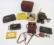 Kodak Pronto 105mm folding camera, an Eastman Kodak Company folding camera, another, a Mycro