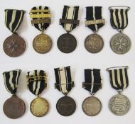 Two silver and one bronze Southern Railway medals awarded to William Corben. Together with one