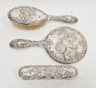 Elizabeth II three-piece silver-backed Victorian-style dressing table set, decorated in repousse