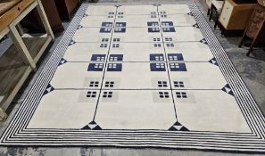Large cream ground carpet with four rows of ten square medallions in groups of four on geometric