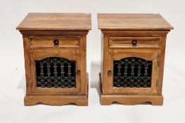Pair of hardwood bedside cabinets, each having a single drawer with metal drop ring handle and