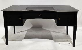 Modern writing desk, having a black finish, the top with inset writing surface, inverted curve
