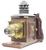19th century brass mounted, tin and mahogany cased magic lantern, the brass lens engraved Wm Hume,