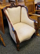 Late 19th/early 20th century mahogany show frame salon armchair with carved cresting rail and