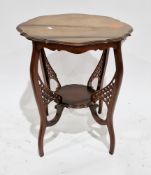 Early 20th century mahogany centre table, the top with shaped moulded edge, the four shaped legs