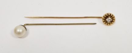 Victorian gold stickpin set with a central diamond within wirework and bead mount, unmarked,