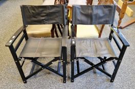 Two Italian designer folding chairs by Caracalla, with black leatherette seats and ebonised