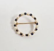Modern 9ct gold circle brooch set with alternating sapphires and cultured pearls, 2.5cm diameter,
