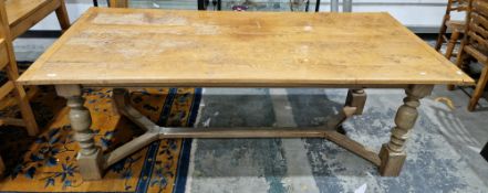 Large oak refectory dining table in the 17th century manner, the plank top with cleated ends, on cup