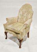 Early 20th century camel back armchair in the Queen Anne manner, with cream monkey pattered