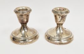 Pair of silver desk candlesticks, Birmingham 1977, A Chick & Sons, with reeded urn-shaped scones and