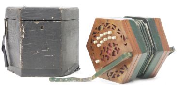 Metzler & Co of London concertina, no. 26372,  having twenty-one bone buttons on pierced mahogany