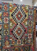 Chobi kilim cream ground runner, with five central stepped lozenge medallions, single geometric