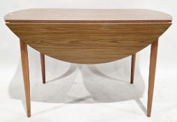 Mid century Schreiber teak veneered drop flap dining table, of oval form on turned tapering legs,