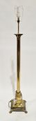 Brass Corinthian column standard lamp, on a square stepped base with engraved detail and four lion