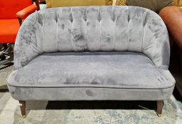 Contemporary grey upholstered loveseat or settee, with buttoned and pleated back, curved arms and