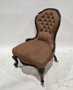Victorian walnut framed lady's balloon buttonback salon chair, with carved top rail, on carved