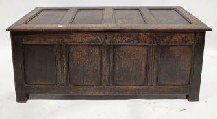 18th century oak coffer, the four panel hinged lid opening to an empty space, over a four panel