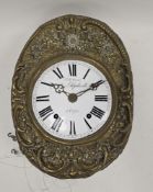 19th century French brass comtoise wall clock, of oval form with pressed floral and foliate scroll