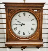 19th century American oak wall clock, the square case housing a circular white enamel dial with