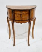 Louis XV style burr walnut side table of demi-lune form, the brass bound top over three drawers with