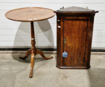 19th century wall-hanging corner cupboard, the panelled door opening to reveal two fitted shelves,