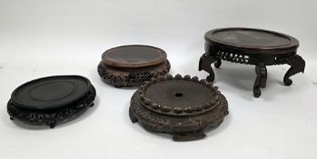 Group of Chinese and South East Asian wooden vase stands, including a footed and pierced example,