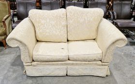 Knole style drop-end two seater sofa, upholstered in yellow fabric with cushion back and seats, on