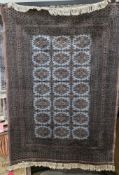 Large grey ground rug with three rows of seven medallions on geometric grid, multiple geometric