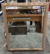Modern rectangular wall mirror, the bevelled plate in a gilt-effect frame with moulded foliate