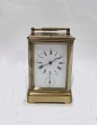 Gilt brass repeating 1/4 striking alarm carriage clock, the enamel dial with roman numerals and