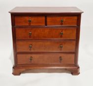 Marks & Spencers mahogany-finish chest, the rectangular top with cross banding and canted corners,