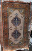 Modern Belgium wool cream ground khalif rug with two central geometric medallions, geometric