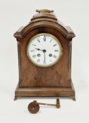 Early 20th century mahogany cased mantel clock, the domed top with brass loop carrying handle, the