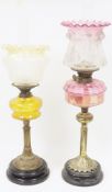 Duplex brass oil lamp with cranberry glass reservoir and etched cranberry glass shade (damaged) on