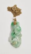 Carved jade pendant depicting a monkey with fruit, approx 3.5cm long, on a fine Italian gold chain