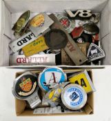 Collection of vintage car badges including AA badge (registration OB93787), square AA badge, Ford