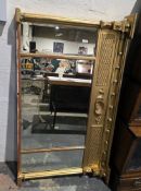 Gilt framed overmantel mirror in the Regency manner, the relief moulded frieze with ball, shelf