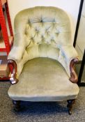 Victorian mahogany nursing chair with carved scroll detail and turned legs, with green button back