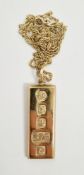 9ct gold ingot pendant with show hallmarks for Sheffield 1979, on 9ct gold chain, total weight 34.5g