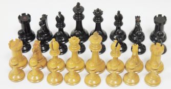 Early 20th century Staunton ebony and boxwood chess set, the rook and knight marked with a red