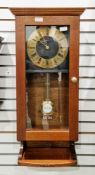 Western Germany mahogany regulator-type wall clock, the black face with brass chapter ring having