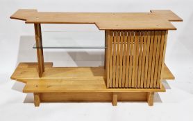 Hand-built oak side cabinet by A Channing, the shaped top over a glass shelf flanked by a pair of