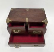 Mahogany and brass bound table top cabinet in the 19th century campaign style, comprising three