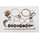 Silver hinged bangle with engraved decoration, Birmingham 1970, another hinged silver bangle with